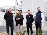 Andreas Benkö, Christine Romirer-Maierhofer, Thomas Schendl and Kristian Vuksan with the John Deere Award at the Großpetersdorf site.